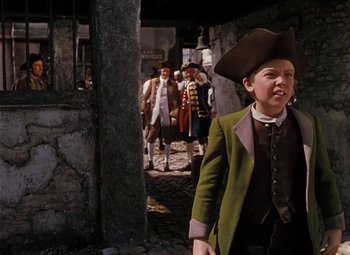 Movie still from “Treasure Island” (1950), directed by Byron Haskin – A group of people dressed up in costumes; Medium shot, Over the shoulder angle