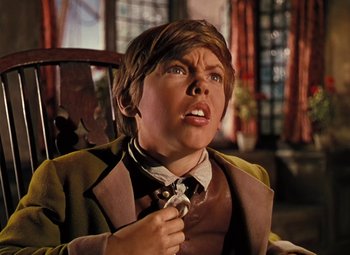 Movie still from “Treasure Island” (1950), directed by Byron Haskin – A wax statue of a boy in a suit and tie; Close Up shot, Low angle