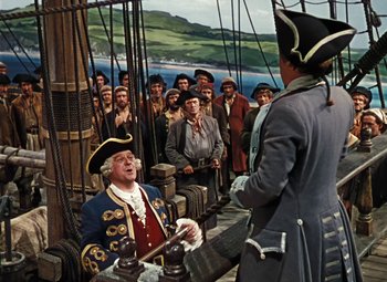 Movie still from “Treasure Island” (1950), directed by Byron Haskin – A group of people on a boat in the water; Wide shot, High angle