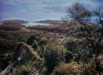 Movie still from “Treasure Island” (1950), directed by Byron Haskin – An oil painting of a view of the ocean from a hill; Extreme Wide shot, High angle