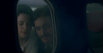 Movie still from “Trouble Every Day” (2001), directed by Claire Denis – A man with a beard is looking out of a window; Close Up shot, Low angle