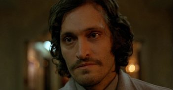 Movie still from “Trouble Every Day” (2001), directed by Claire Denis – A person with long hair; Close Up shot, Low angle