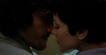 Movie still from “Trouble Every Day” (2001), directed by Claire Denis – A man and a woman face to face in the dark; Close Up shot, Low angle