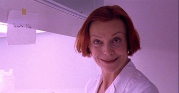 Movie still from “Trouble Every Day” (2001), directed by Claire Denis – A person with red hair; Close Up shot, Low angle