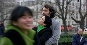 Movie still from “Trouble Every Day” (2001), directed by Claire Denis – A man and a woman standing next to each other; Close Up shot, Low angle