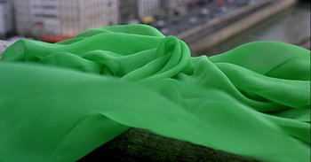Movie still from “Trouble Every Day” (2001), directed by Claire Denis – View of a bright green cloth; Close Up shot, Overhead angle