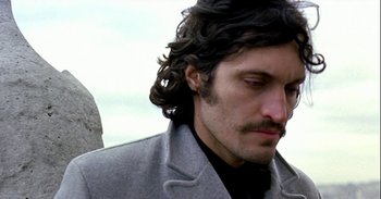 Movie still from “Trouble Every Day” (2001), directed by Claire Denis – A person with long hair; Close Up shot, Low angle