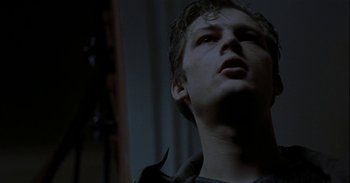Movie still from “Trouble Every Day” (2001), directed by Claire Denis – A young man looking up into the air; Close Up shot, Low angle