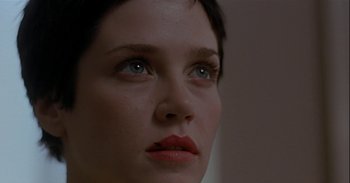 Movie still from “Trouble Every Day” (2001), directed by Claire Denis – A woman's face with red lipstick; Extreme Close Up shot, Low angle