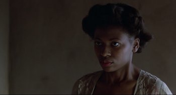 Movie still from “True Confessions” (1981), directed by Ulu Grosbard – A person wearing a dress; Close Up shot, Over the shoulder angle