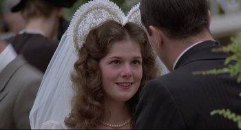 Movie still from “True Confessions” (1981), directed by Ulu Grosbard – A young woman wearing a veil and a tiara; Close Up shot, Over the shoulder angle
