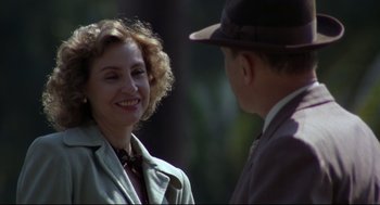 Movie still from “True Confessions” (1981), directed by Ulu Grosbard – A man and a woman talking to each other outside; Close Up shot, Over the shoulder angle