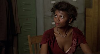 Movie still from “True Confessions” (1981), directed by Ulu Grosbard – A woman sitting in a chair looking off into the distance; Close Up shot, Over the shoulder angle