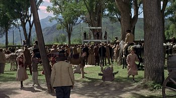 Movie still from “True Grit” (1969), directed by Henry Hathaway – A crowd of people standing around a tree; Extreme Wide shot, High angle