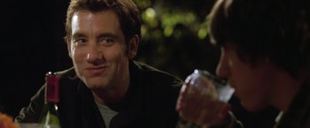 Movie still from “Trust” (2010), directed by David Schwimmer – A person holding a glass of water; Close Up shot, Over the shoulder angle