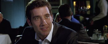 Movie still from “Trust” (2010), directed by David Schwimmer – A person wearing a suit and tie; Close Up shot, Over the shoulder angle