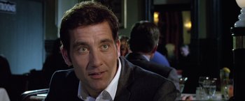 Movie still from “Trust” (2010), directed by David Schwimmer – A person wearing a suit and tie; Close Up shot, Over the shoulder angle