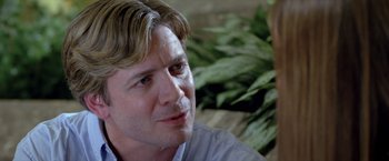 Movie still from “Trust” (2010), directed by David Schwimmer – A person sitting down; Close Up shot, Over the shoulder angle