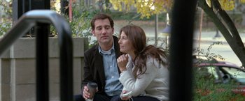 Movie still from “Trust” (2010), directed by David Schwimmer – A man and a woman sitting next to each other on a park bench; Medium shot, Over the shoulder angle