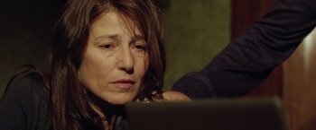 Movie still from “Trust” (2010), directed by David Schwimmer – A person using a laptop computer; Close Up shot, Over the shoulder angle