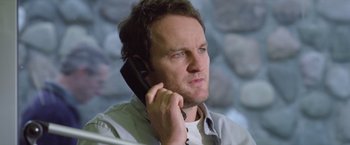 Movie still from “Trust” (2010), directed by David Schwimmer – A person talking on a cell phone; Close Up shot, Low angle