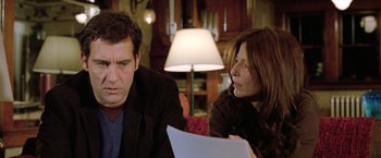 Movie still from “Trust” (2010), directed by David Schwimmer – A man and a woman sitting next to each other on a couch; Close Up shot, Low angle