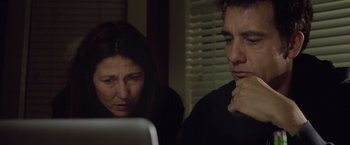 Movie still from “Trust” (2010), directed by David Schwimmer – A woman and a man looking at a computer screen; Close Up shot, Low angle