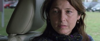 Movie still from “Trust” (2010), directed by David Schwimmer – A person with long hair; Close Up shot, Over the shoulder angle