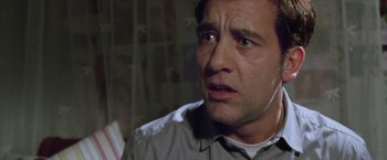 Movie still from “Trust” (2010), directed by David Schwimmer – A person wearing headphones; Close Up shot, Low angle