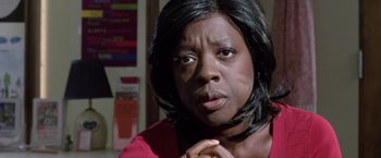 Movie still from “Trust” (2010), directed by David Schwimmer – A person wearing a red shirt with her hand on her chin; Close Up shot, Over the shoulder angle