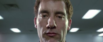 Movie still from “Trust” (2010), directed by David Schwimmer – A man's face in a dark room; Extreme Close Up shot, Low angle