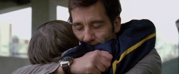 Movie still from “Trust” (2010), directed by David Schwimmer – A person holding a child; Close Up shot, Low angle
