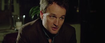 Movie still from “Trust” (2010), directed by David Schwimmer – A person wearing a suit and tie; Close Up shot, Over the shoulder angle