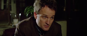 Movie still from “Trust” (2010), directed by David Schwimmer – A person wearing a suit and tie; Close Up shot, Over the shoulder angle