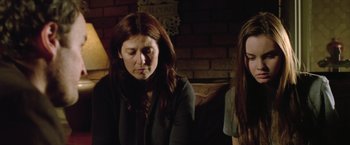 Movie still from “Trust” (2010), directed by David Schwimmer – Two women sitting next to each other in a room; Close Up shot, Low angle