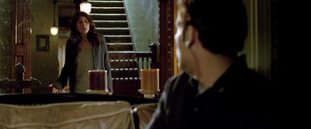 Movie still from “Trust” (2010), directed by David Schwimmer – A man and a woman in front of a staircase; Medium shot, Over the shoulder angle