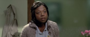 Movie still from “Trust” (2010), directed by David Schwimmer – A woman in a brown sweater looking at the camera; Close Up shot, Over the shoulder angle