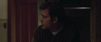 Movie still from “Trust” (2010), directed by David Schwimmer – A person sitting in front of a window; Close Up shot, Over the shoulder angle
