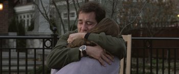 Movie still from “Trust” (2010), directed by David Schwimmer – A man and a woman hugging each other outside; Close Up shot, Over the shoulder angle