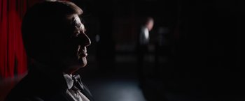 Movie still from “Truth” (2015), directed by James Vanderbilt – An older man with a beard and a mustache; Close Up shot, Over the shoulder angle