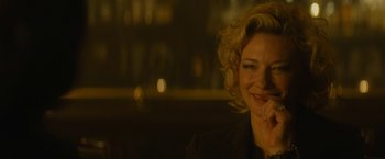 Movie still from “Truth” (2015), directed by James Vanderbilt – A woman sitting in front of a window smiling; Close Up shot, Over the shoulder angle