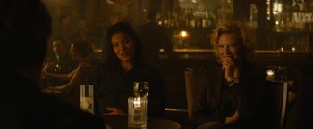 Movie still from “Truth” (2015), directed by James Vanderbilt – Two women sitting at a table in front of a glass of wine; Medium shot, Over the shoulder angle