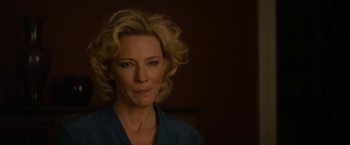 Movie still from “Truth” (2015), directed by James Vanderbilt – A woman with blonde curly hair is looking at the camera; Close Up shot, Over the shoulder angle