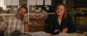 Movie still from “Truth” (2015), directed by James Vanderbilt – Two people sitting at a table with papers on the table; Medium shot, Over the shoulder angle
