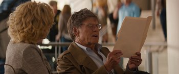 Movie still from “Truth” (2015), directed by James Vanderbilt – An older man sitting down reading a piece of paper; Close Up shot, Over the shoulder angle