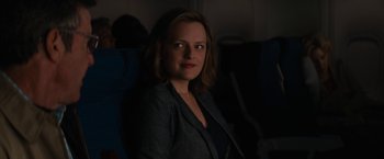 Movie still from “Truth” (2015), directed by James Vanderbilt – A woman sitting in a chair on a plane; Close Up shot, Over the shoulder angle