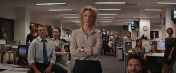 Movie still from “Truth” (2015), directed by James Vanderbilt – A woman standing in an office with her arms crossed; Medium shot, Low angle