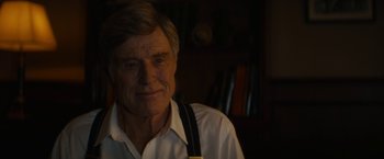 Movie still from “Truth” (2015), directed by James Vanderbilt – An older man wearing suspenders in a dark room; Close Up shot, Over the shoulder angle