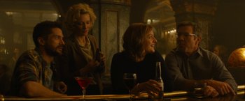 Movie still from “Truth” (2015), directed by James Vanderbilt – Two women are sitting at a bar and one is holding a cell phone; Medium shot, Over the shoulder angle