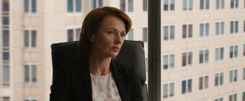 Movie still from “Truth” (2015), directed by James Vanderbilt – A woman sitting in an office chair in front of a window; Close Up shot, Over the shoulder angle